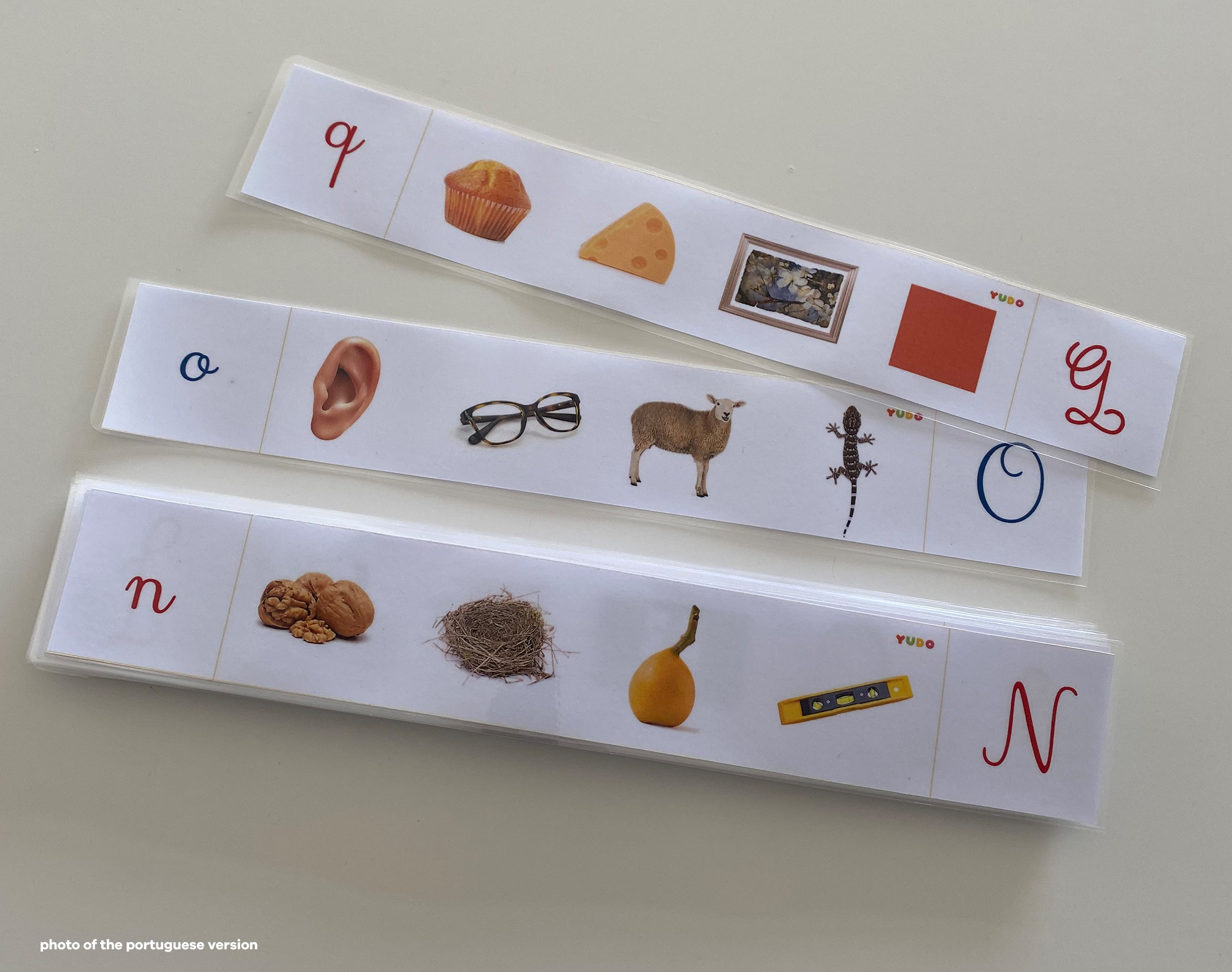 Child using Montessori beginning sounds strips activity